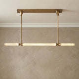 Blain LED Linear Pendant 48", Vintage Brass linear Pendant in a Transitional Dining Room with a walnut dining table.