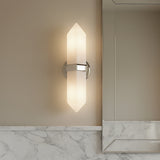 Modern Gracy 2 Light Wall Sconce, Polished Nickel and Alabaster shade next to a vanity mirror with a marble backsplash. 
