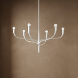 Anita 6 Light Chandelier 37", White Plaster finish, on a textured brown backdrop.