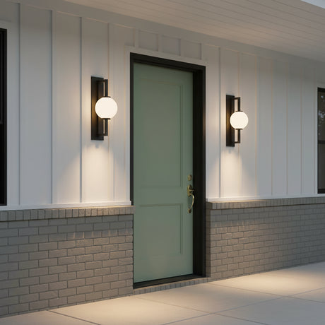 Gus Outdoor Wall Light, Large 24" Textured Black - Two globe MCM wall lights flanking a green front door on a ranch style home.