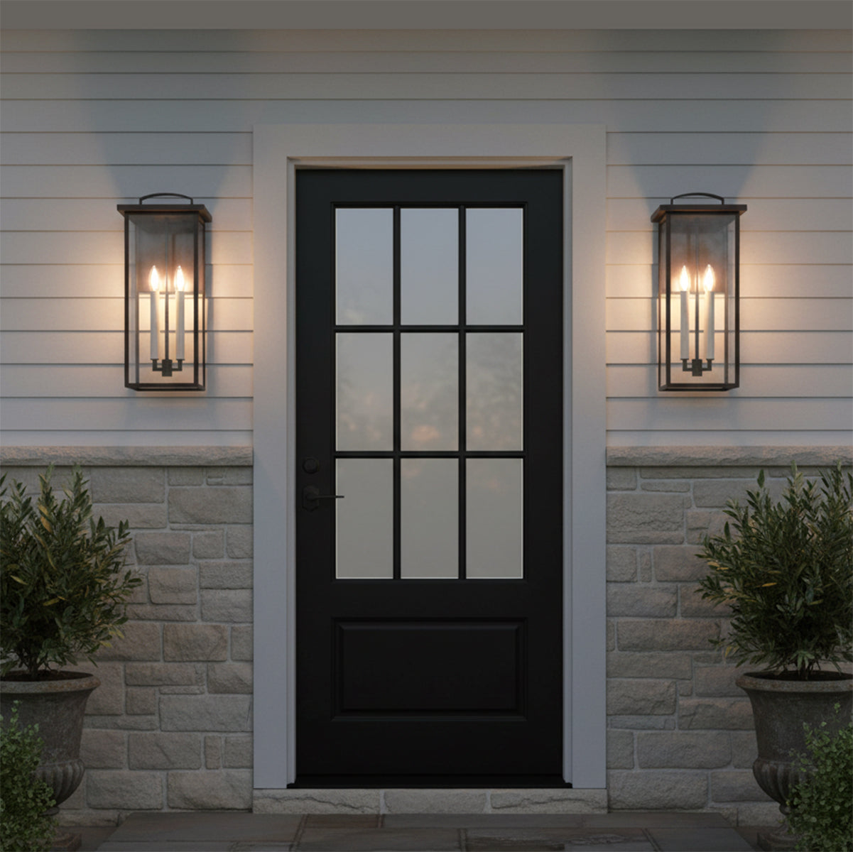 Sullivan Outdoor Wall Light, Large 22" Bronze - Symmetrical view of a black door flanked by two bronze wall lights