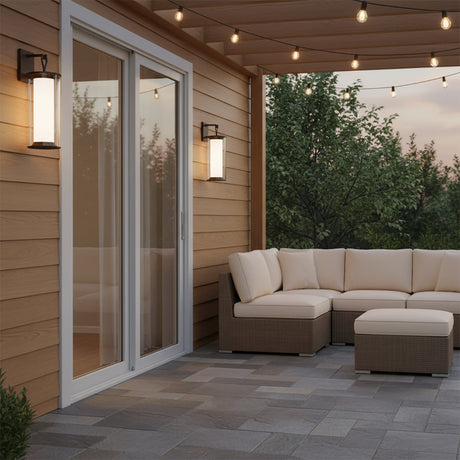 Halsey Outdoor Wall Light, 23" Bronze - Two bronze outdoor wall lights flank a sliding glass door on a patio.