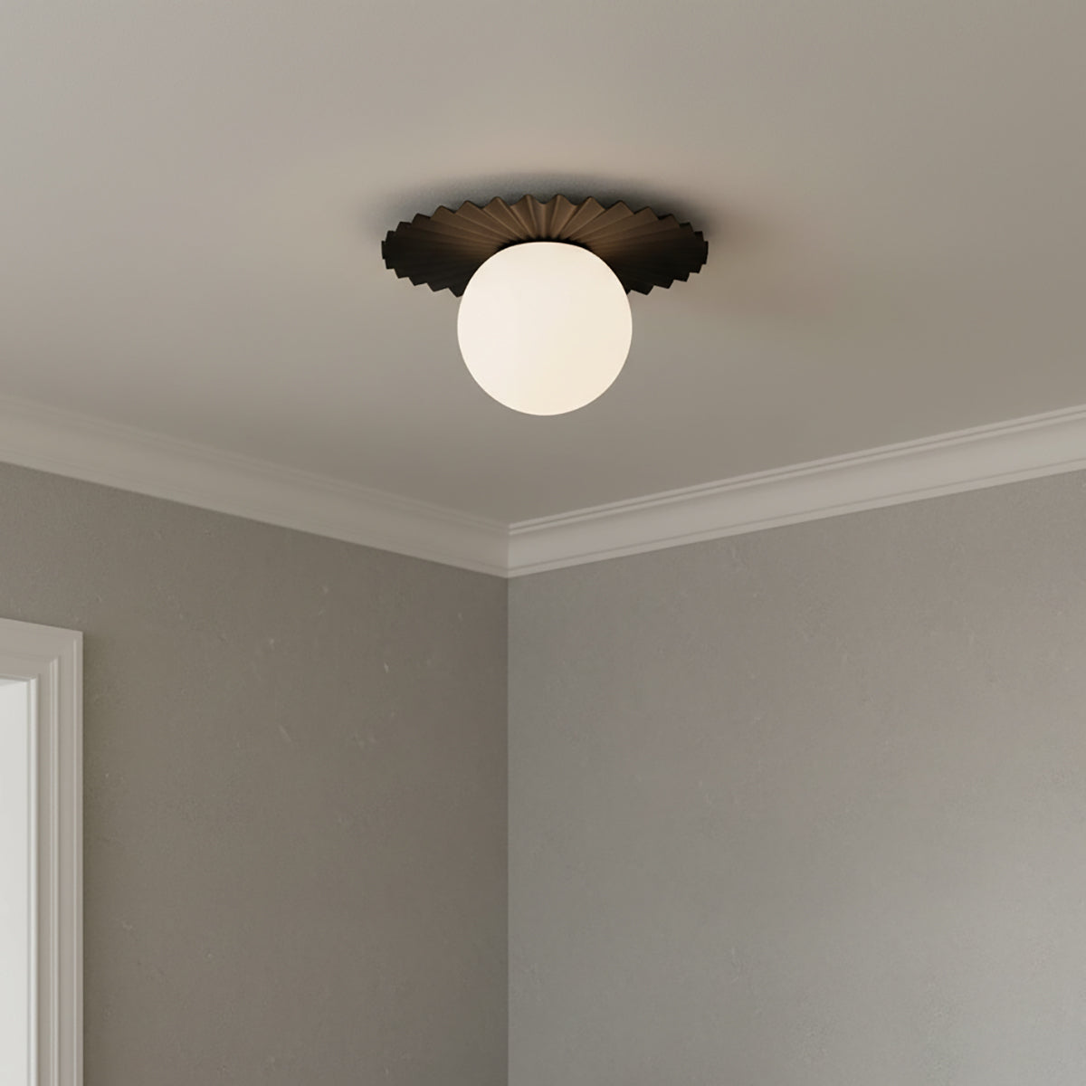 Lydia Flush Mount 14", Black and Opal Glass - A black and opal glass flush mount ceiling light is centered on a white ceiling, in a room with gray walls.