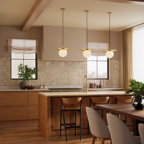 Modern kitchen with wooden cabinets, three Lydia 14" pendant lights, and a dining area.
