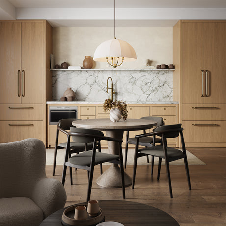 Trudy 4 Light Large Pendant in Brushed Brass with Fabric Shade is hung above a four seater dining table in a transitional modern home.