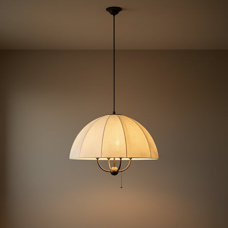 Antique Bronze & Matte Black cream fabric scalloped pendant in a Transitional Living Room with a warm beige wall.