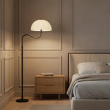 Trudy Floor Lamp, Matte Black - Matte black floor lamp next to nightstand