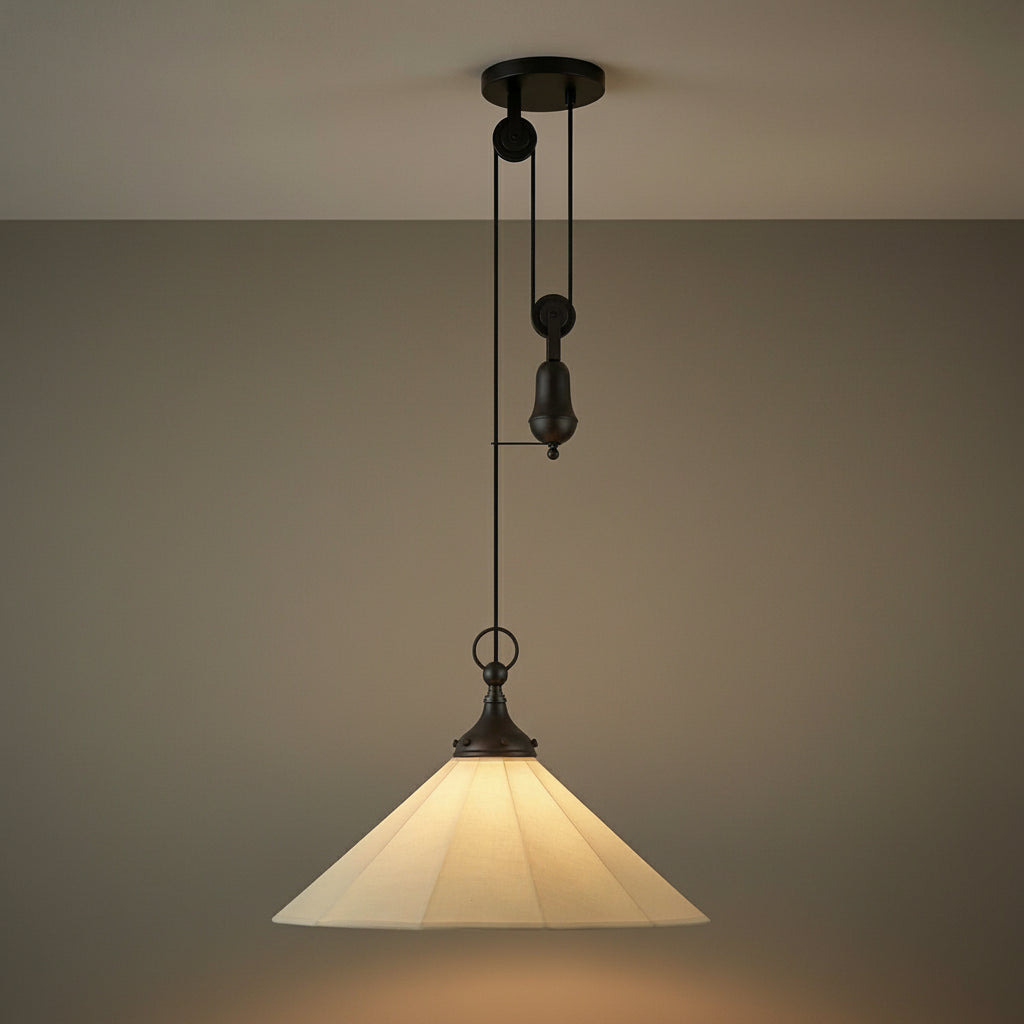 Adele Pendant with Pulley 20", Matte Black with Linen Shade in a Transitional Living Room with a neutral wall.