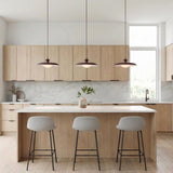Mabel Metal Pendant 15", Maroon with Opal Glass geometric pendant in a Modern Kitchen with a white marble island and light wood cabinets.