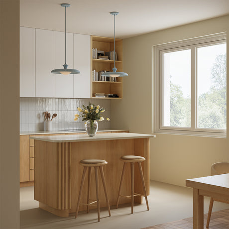 Two Mabel pendant lights in baby blue in a small, bright kitchen above a two-seater island.