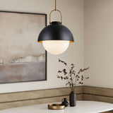 Solene modern black pendant light in a room with a painting and decorative items.