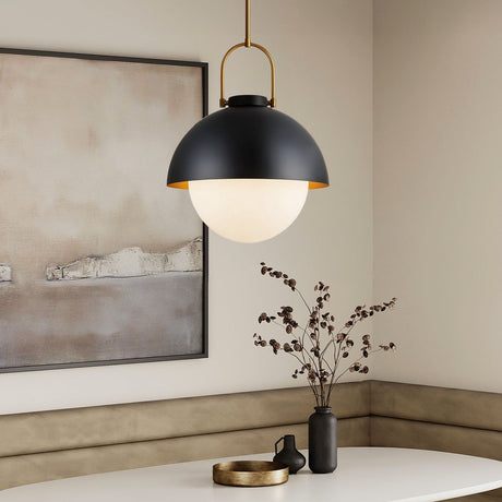 Solene modern black pendant light in a room with a painting and decorative items.