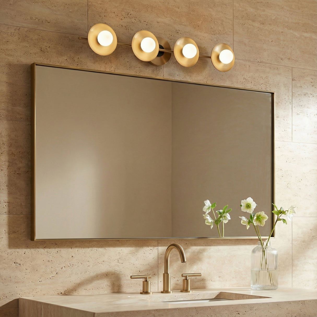 Liam 4 Light Vanity, Aged Brass styled in a Contemporary Bathroom with travertine tile.