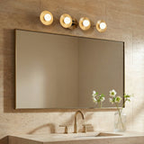 Liam 4 Light Vanity, Aged Brass styled in a Contemporary Bathroom with travertine tile.