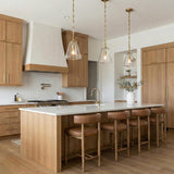 Addison Small Pendant 8", Brass geometric pendant in a Modern Farmhouse Kitchen with a white marble island and leather bar stools.