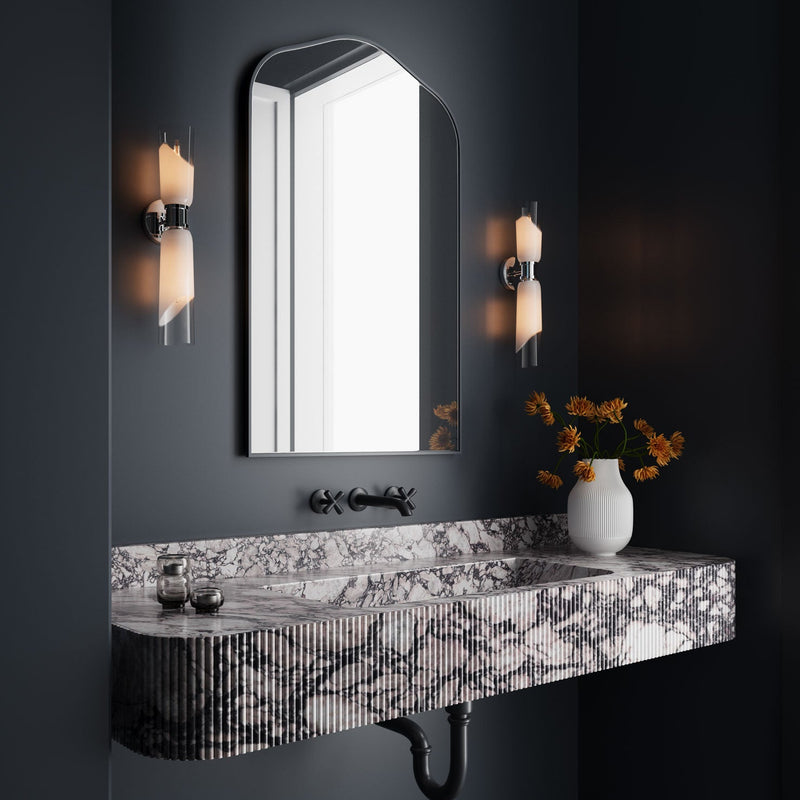 Moody and modern powder room with marble countertop, mirror, and two Brooke wall lights in polished nickel finish on a dark grey wall.