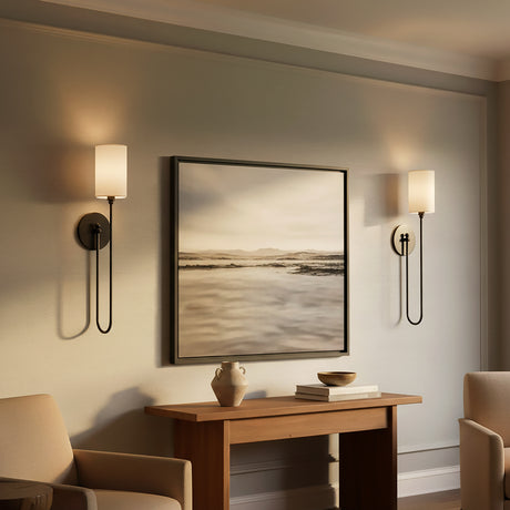 Briar Wall Sconce 24", Old Bronze - A pair of wall sconces flanking a framed picture above a wooden console table.