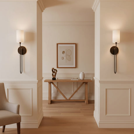 Briar Wall Sconce 24, Old Bronze - Two elegant wall sconces with white shades and old bronze fixtures illuminate a hallway with a wooden console table and artwork.