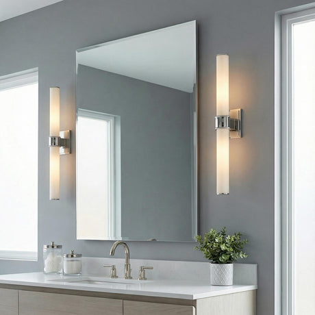 Griffin 2 Light Vanity 20", Polished Nickel linear Vanity in a Contemporary Bathroom with a frameless mirror and white countertop.