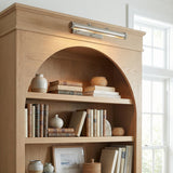 Graham Large Picture Light, Vintage Nickel linear Picture Light in a Transitional Living Room with a natural oak bookcase.