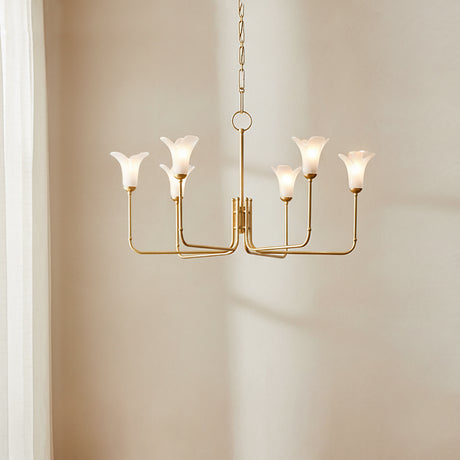 Dahlia 6 Light Chandelier 40, Gold Leaf - A gold chandelier with six frosted glass shades resembling flower buds hangs against a textured cream wall with soft, sheer white curtains to the left.