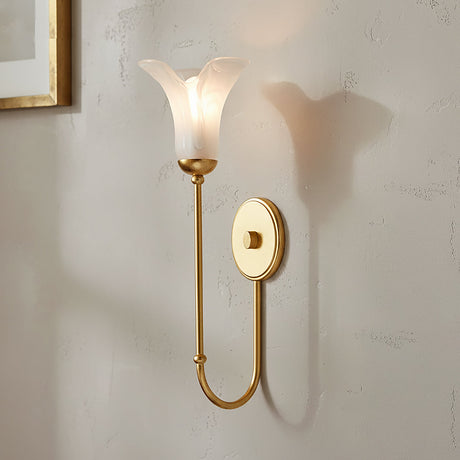 Dahlia 20" tall gold wall sconce with a white art-glass shade on a light gray wall.