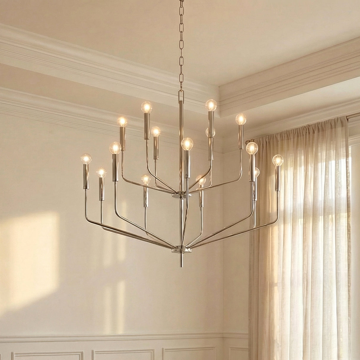 Hollis 15 Light Two-Tier Chandelier 36", Polished Nickel geometric chandelier in a Transitional Living Room with sheer linen curtains.