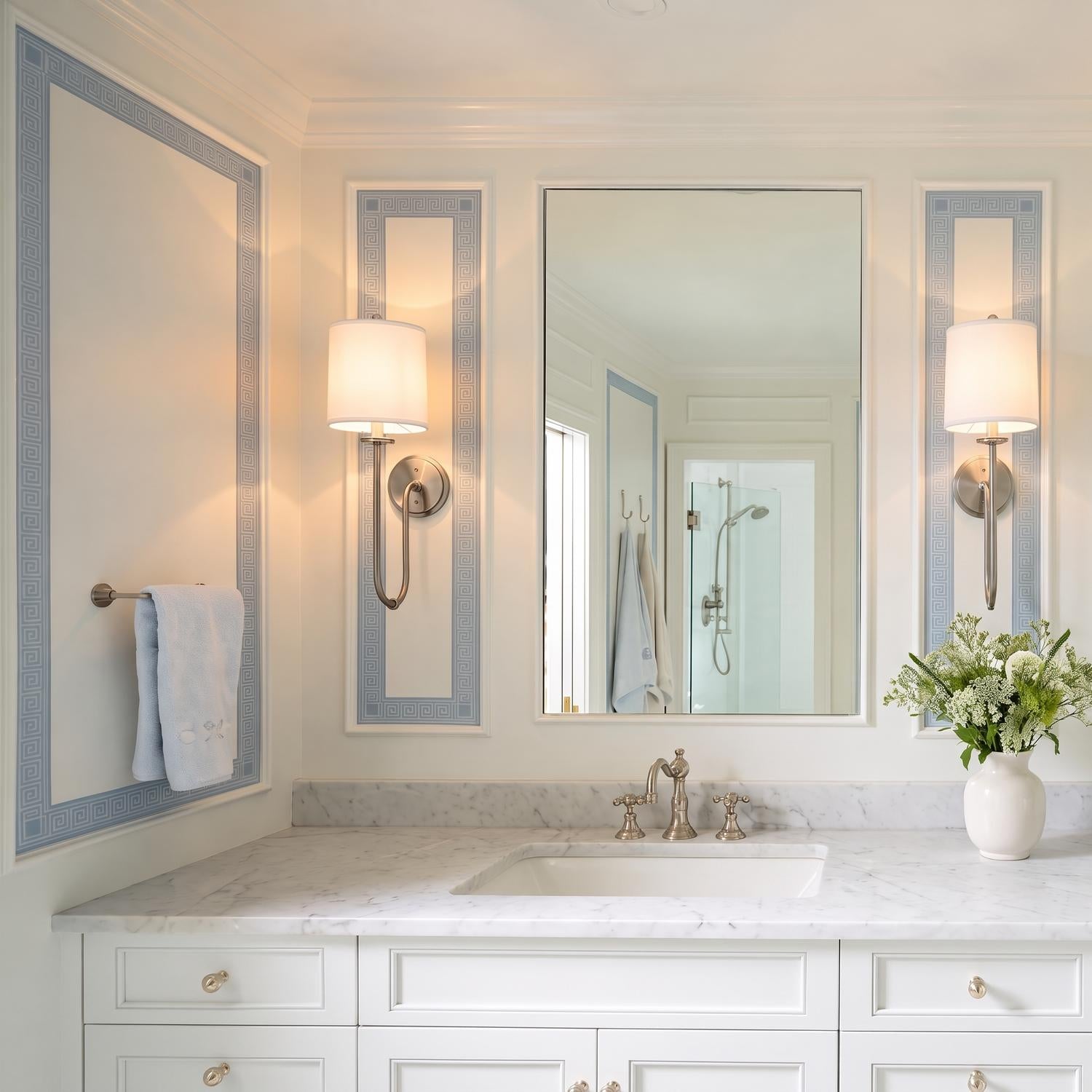 A traditional bathroom features two Hayden Wall Sconce 21