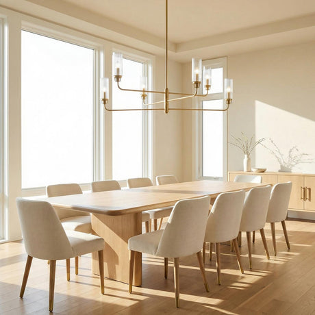 Mercer 6 Light Chandelier 48", Aged Brass linear chandelier in a Modern Dining Room with a light wood dining table.
