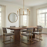 Navie 5 Light Chandelier 30", Aged Brass geometric Chandelier in a Transitional Dining Room with a dark wood table and gray chairs.