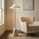 Rhea Floor Lamp, Aged Brass & Cream geometric floor lamp in a Modern Living Room with a cream boucle armchair.