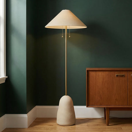 Tessa Floor Lamp, Textured Beige with Aged Brass linear floor lamp in a Mid-Century Living Room with a wood cabinet.