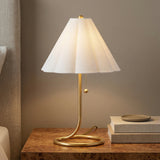 Aged Brass linear Table Lamp in a Transitional Bedroom with a burl wood nightstand.