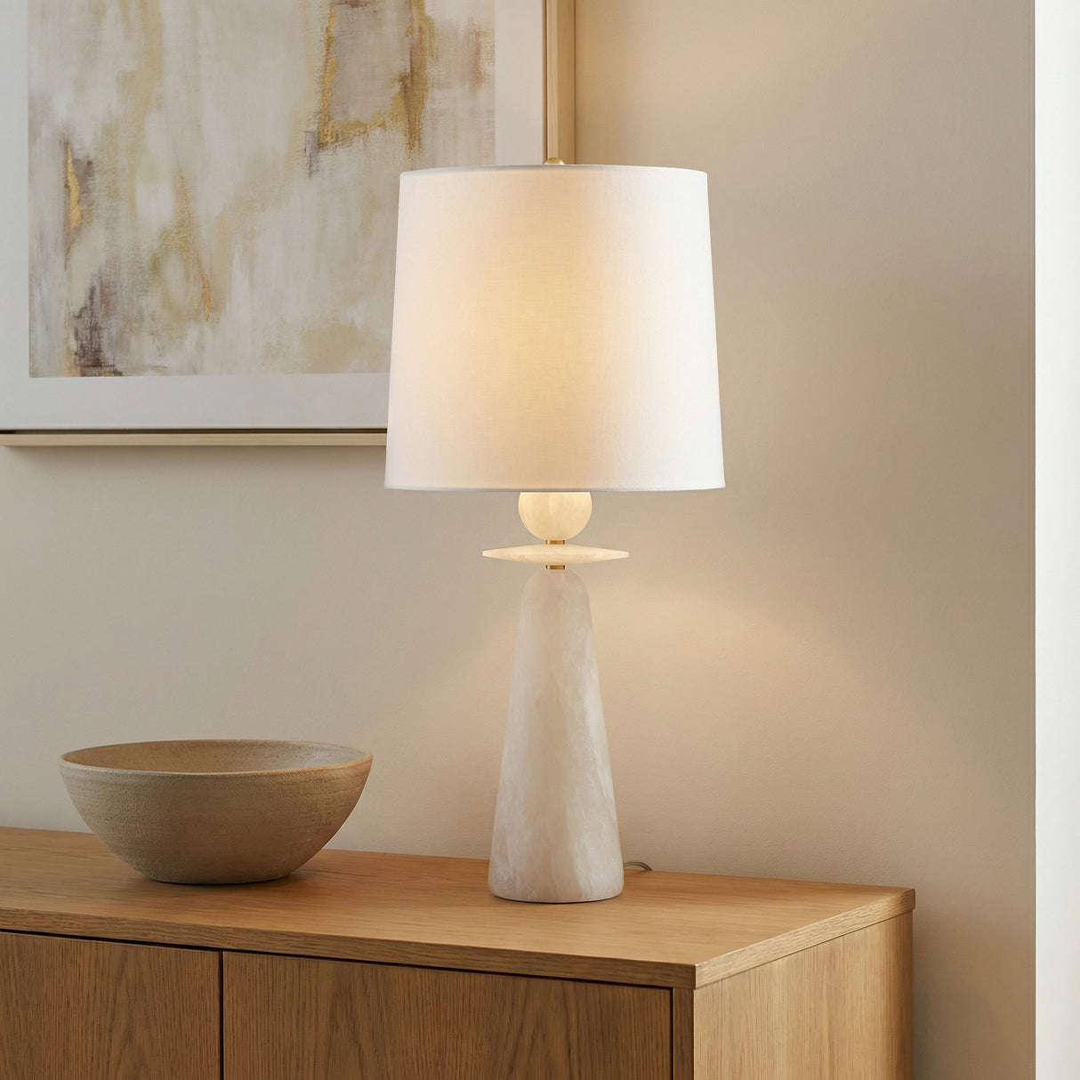 Juliet Table Lamp, Alabaster with Brass Accents styled in a Modern living room with wooden sideboard.