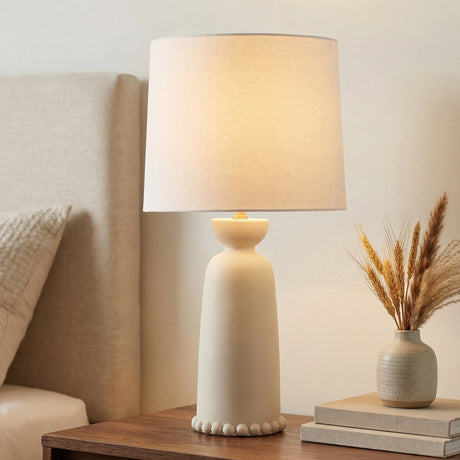 Bonnie Ceramic Table Lamp, Antique Ivory beaded Table Lamp in a Transitional Bedroom with a dark wood nightstand.