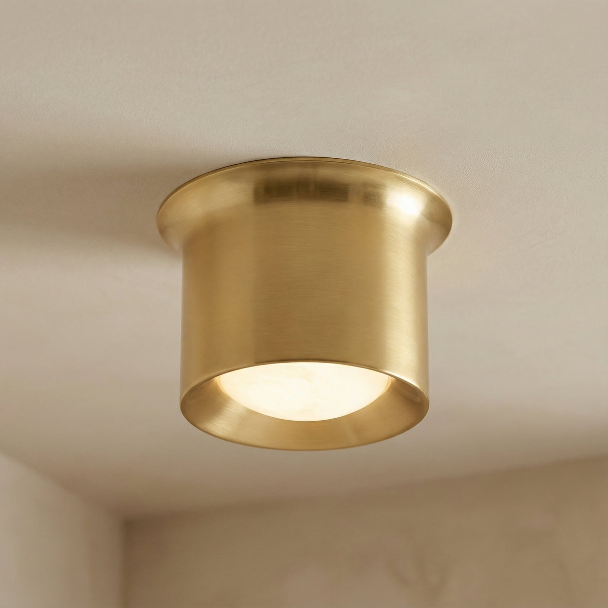 Jonah LED Flush Mount 7", Aged Brass geometric flush mount in a Modern Living Room with clean, neutral walls.