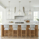 Lana Pendant 16", Polished Nickel and Clear Glass globe pendant in a Modern Farmhouse Kitchen with a white marble island and oak stools.