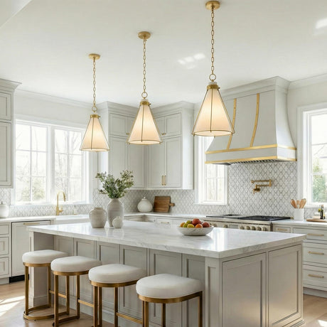 Brass and Cream geometric pendant in a Transitional Kitchen with a white marble island.