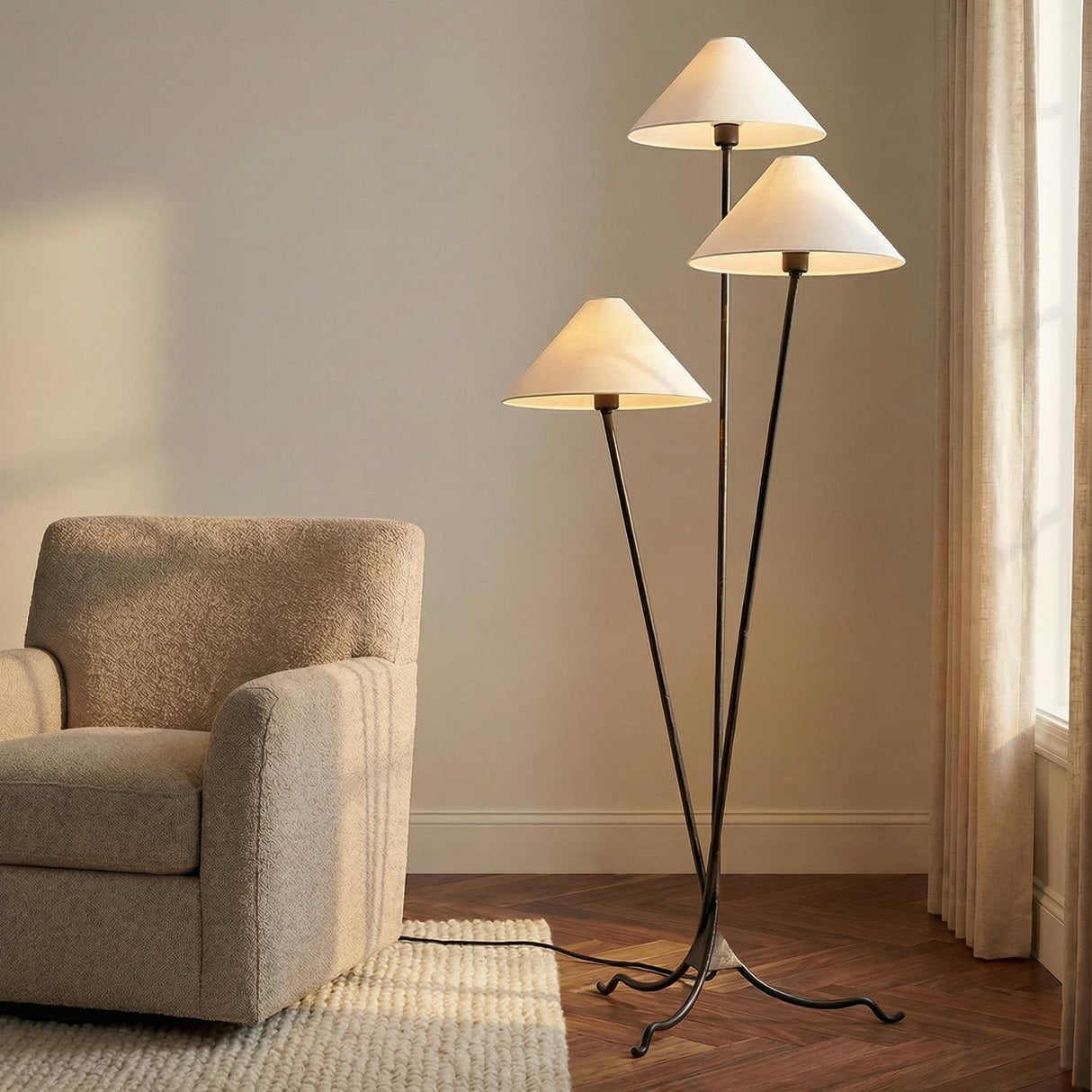 Multi-Arm Floor Lamp, Forged Iron linear floor lamp in a Transitional Living Room with a textured armchair.