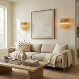 Grace Wall Sconce 14", Brass with Amber Glass linear Wall Sconce in a Modern Living Room with a neutral linen sofa.