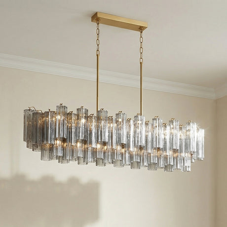 Brass with Smoke Glass geometric linear chandelier in a Contemporary Dining Room with a modern dining table.