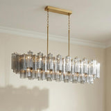 Brass with Smoke Glass geometric linear chandelier in a Contemporary Dining Room with a modern dining table.