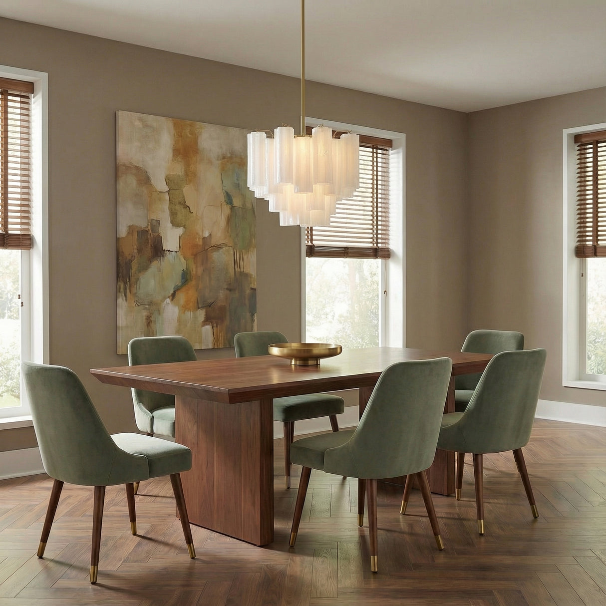 Linear brass chandelier with white glass tubes in a Mid-Century Dining Room with a walnut table and green velvet chairs.