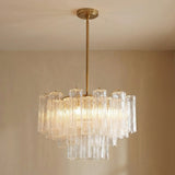 Grace 9 Light Chandelier 22 in a modern living room with beige walls.