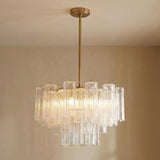 Grace 9 Light Chandelier 22 in a modern living room with beige walls.