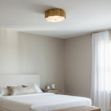 Shana Flush Mount 14, Brushed Brass - A bedroom setting with a brushed brass flush mount ceiling light.