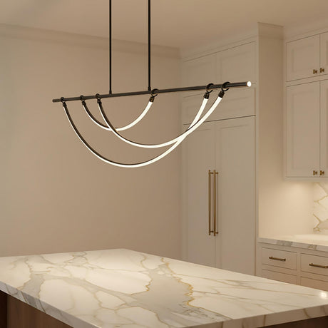 Otis Linear LED Pendant 60, Urban Bronze - A modern linear pendant hangs above a marble countertop in a kitchen.