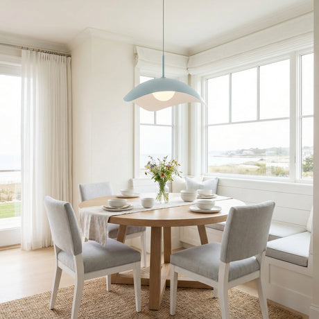 Presley Pendant 22", Baby Blue leaf design pendant in a Coastal Dining Room with a light wood dining table and coastal view.