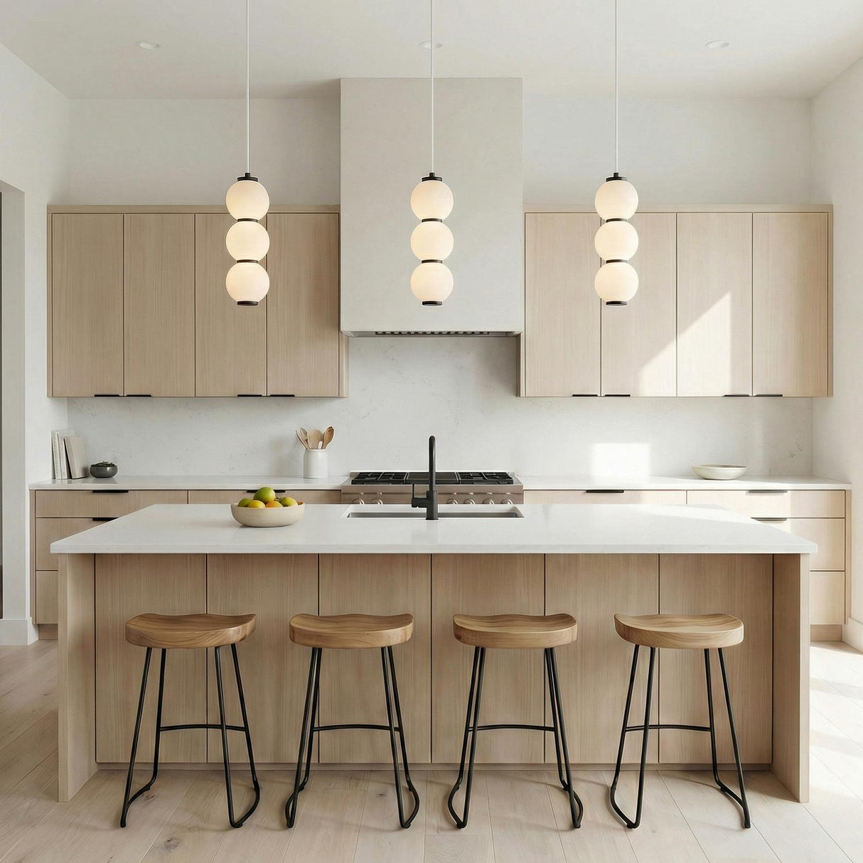 Matte Black and Opal Glass globe pendant in a Modern Kitchen with a white marble island and wood stools.