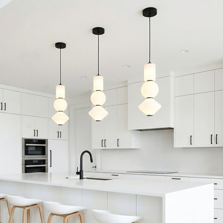 Shai LED Pendant 8", Matte Black and Opal Glass geometric Pendant in a Modern Kitchen with white kitchen island and wood bar stools.